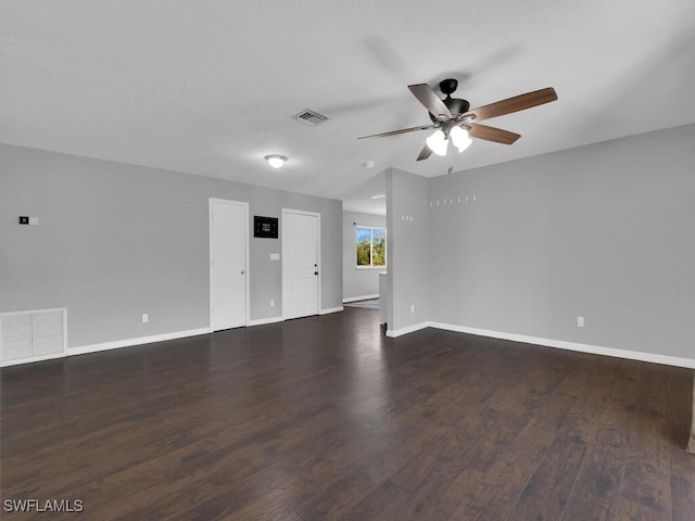 spare room with ceiling fan and dark hardwood / wood-style floors