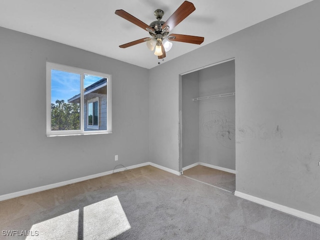 unfurnished bedroom with light carpet, a closet, and ceiling fan