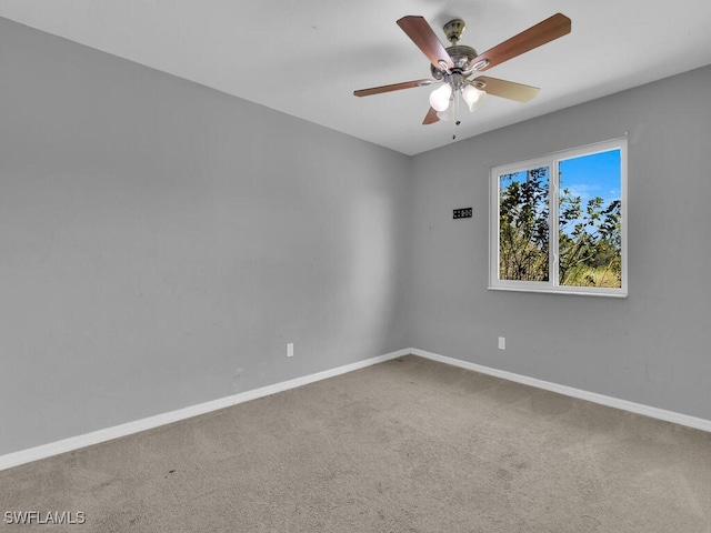 empty room featuring ceiling fan and carpet floors