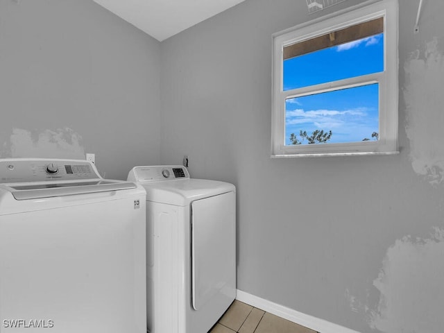 washroom with light tile patterned flooring and separate washer and dryer