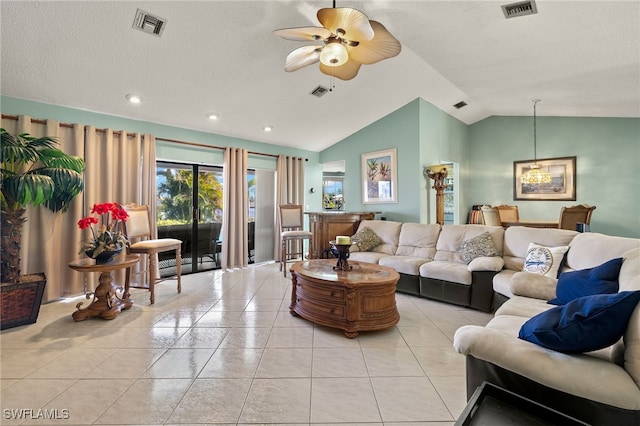 tiled living room featuring a textured ceiling, ceiling fan with notable chandelier, and vaulted ceiling