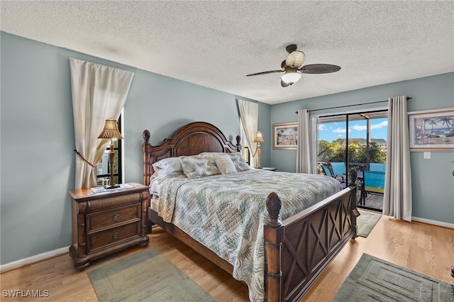 bedroom with ceiling fan, light hardwood / wood-style floors, access to exterior, and a textured ceiling