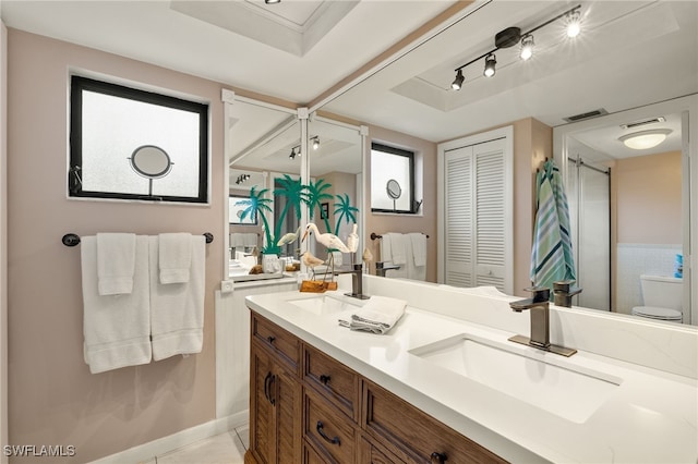 bathroom with tile patterned floors, vanity, and toilet