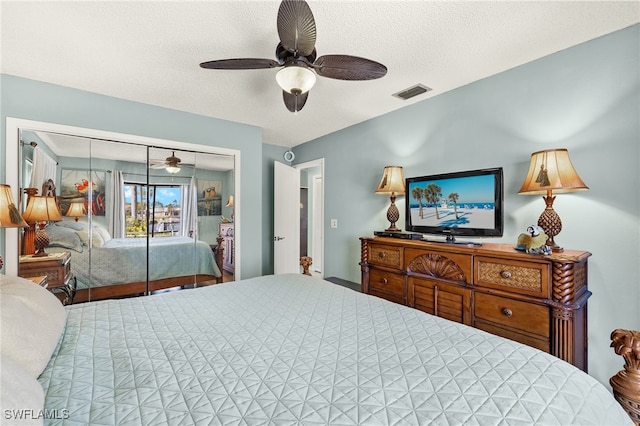 bedroom featuring a textured ceiling, a closet, and ceiling fan