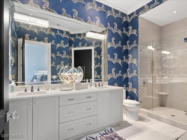 bathroom featuring vanity, a shower with door, crown molding, tile patterned flooring, and toilet