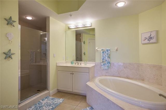 bathroom featuring vanity, tile patterned flooring, and plus walk in shower