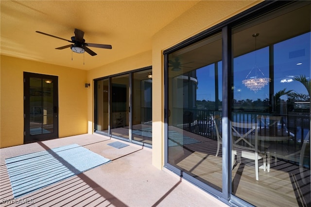 exterior space with ceiling fan