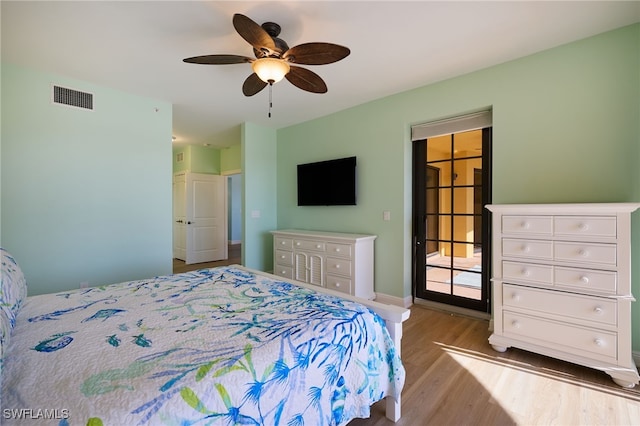 bedroom with ceiling fan and light hardwood / wood-style flooring