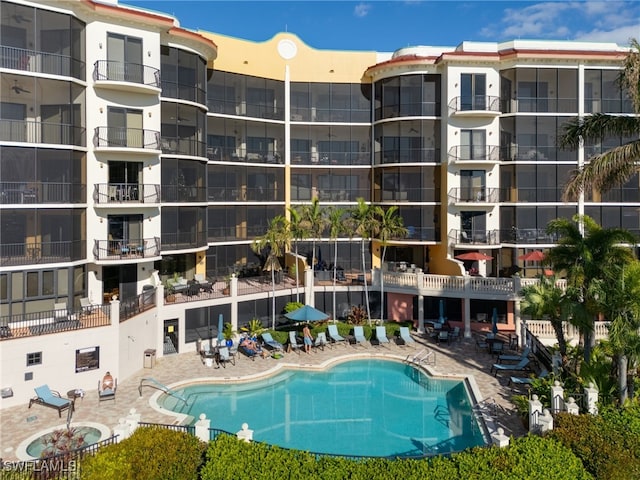 view of swimming pool with a patio