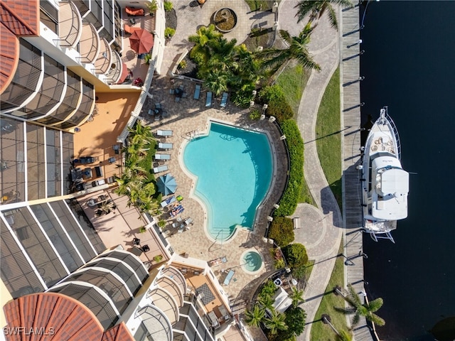 view of pool featuring a water view