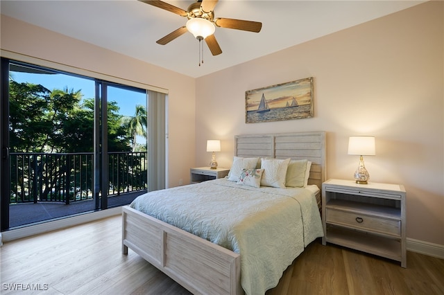 bedroom with hardwood / wood-style floors, ceiling fan, and access to outside