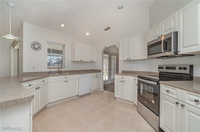 kitchen with white cabinets, pendant lighting, sink, and stainless steel appliances