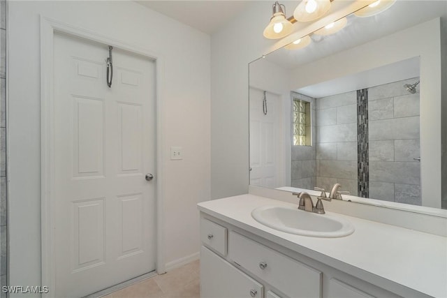 bathroom featuring tile patterned flooring and vanity