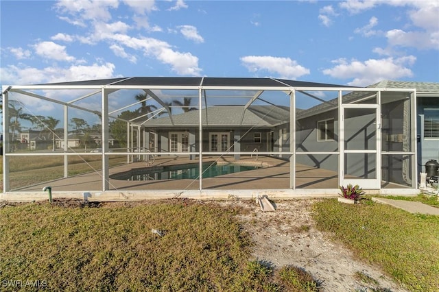 back of house featuring a lanai