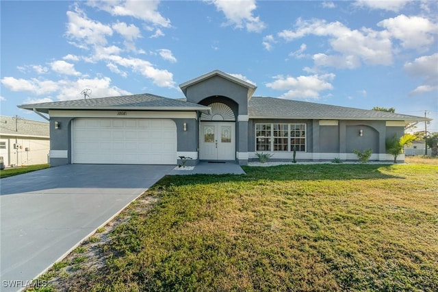 single story home featuring a garage and a front lawn