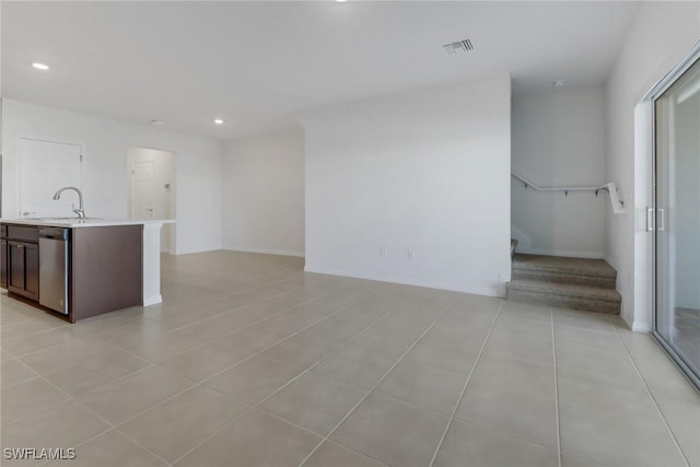 interior space with sink and light tile patterned floors