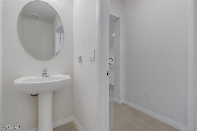 bathroom with tile patterned flooring