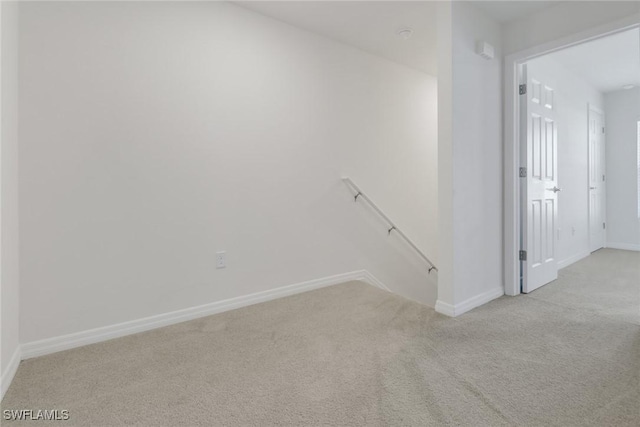 hallway with light carpet