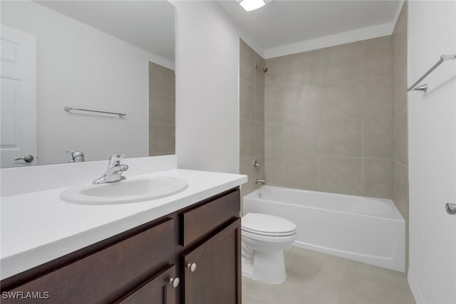 full bathroom featuring tile patterned flooring, vanity, toilet, and tiled shower / bath combo