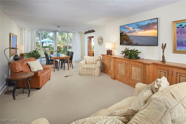 living room with light colored carpet