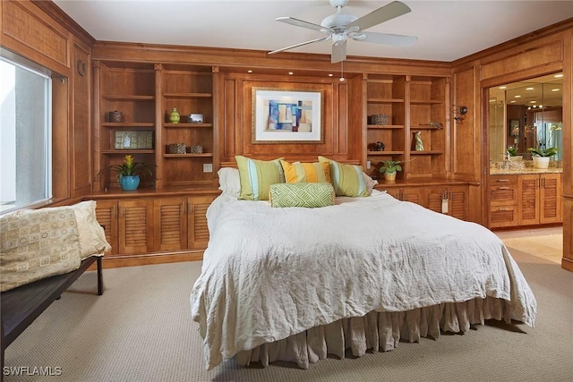 bedroom with light carpet, ceiling fan, and wooden walls