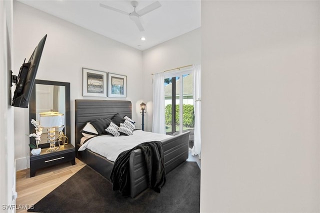 bedroom with light wood-style flooring, a ceiling fan, and recessed lighting