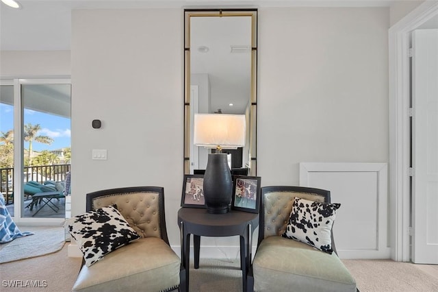 sitting room featuring carpet floors