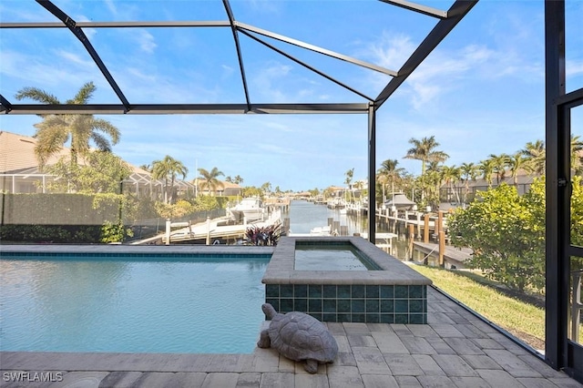 view of swimming pool with a lanai, a water view, a boat dock, and a patio area