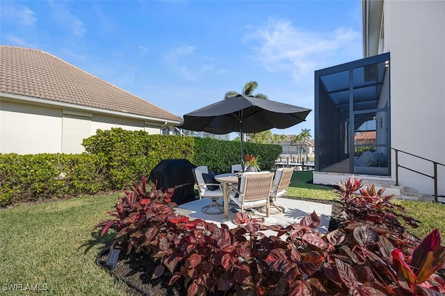 view of patio with a grill