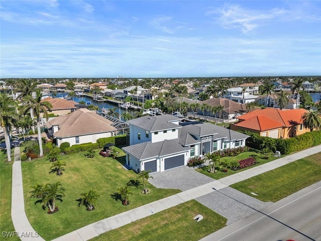 aerial view with a water view and a residential view