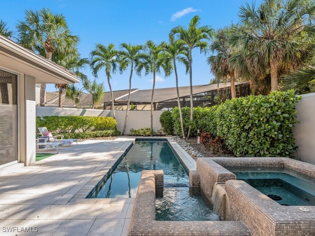 view of pool featuring an in ground hot tub