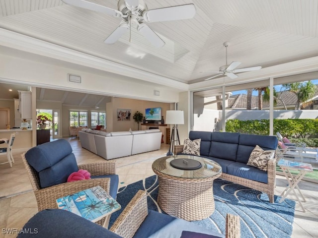 sunroom featuring vaulted ceiling and ceiling fan