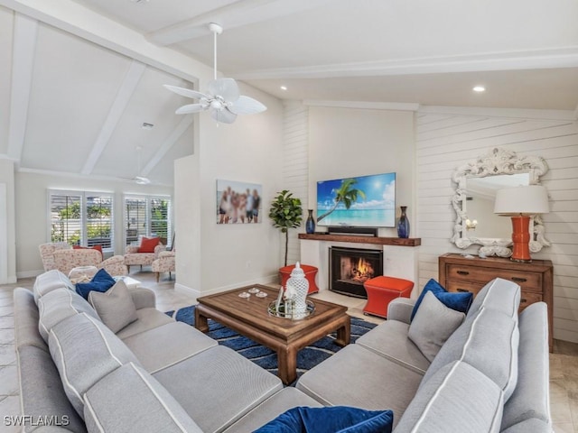 living room featuring vaulted ceiling with beams, ceiling fan, and wooden walls