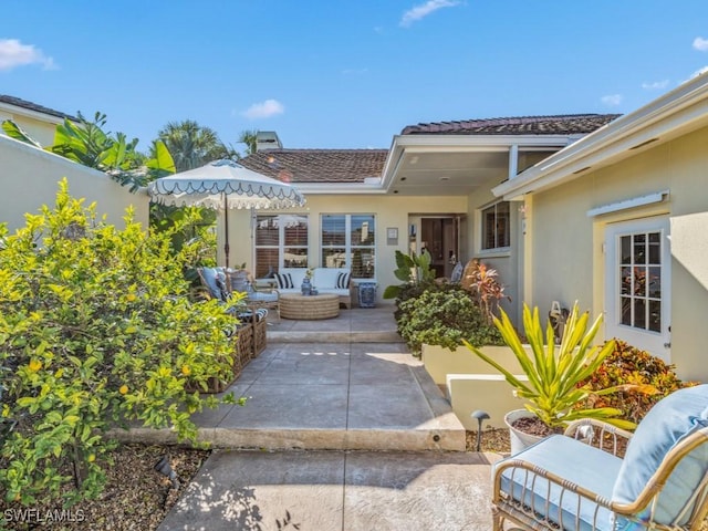 exterior space featuring a patio area and an outdoor living space