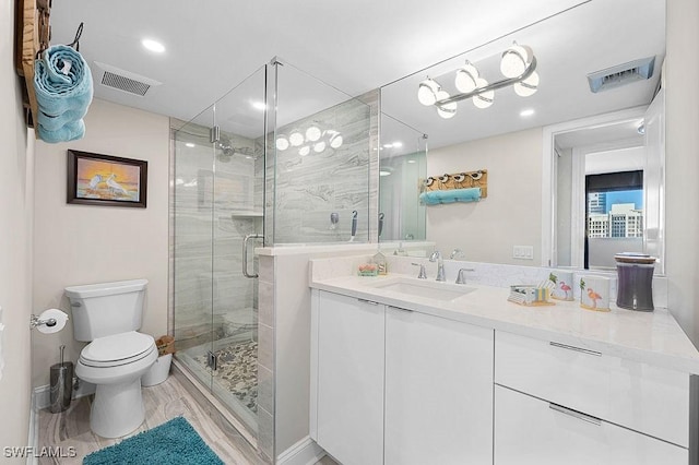 bathroom featuring hardwood / wood-style floors, vanity, toilet, and a shower with shower door