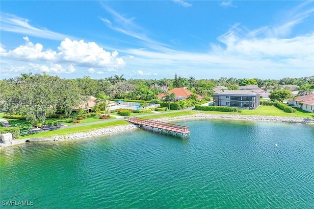 birds eye view of property with a water view