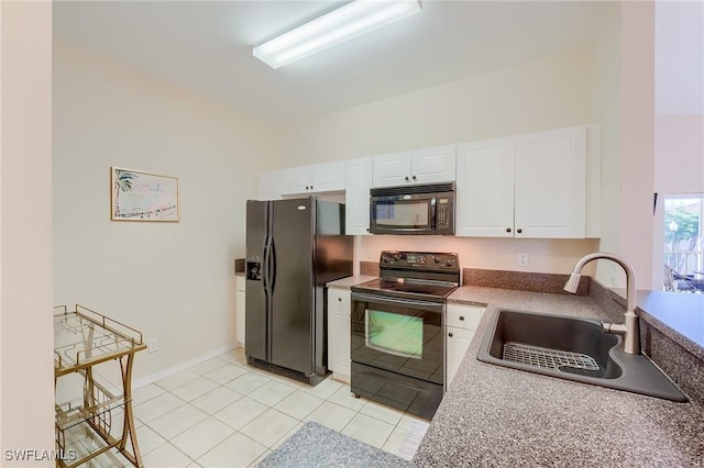 kitchen featuring sink, white cabinets, black appliances, and light tile patterned floors