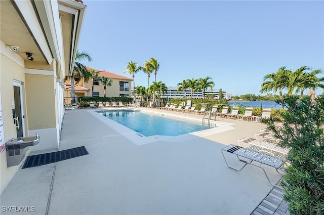 view of swimming pool with a patio area