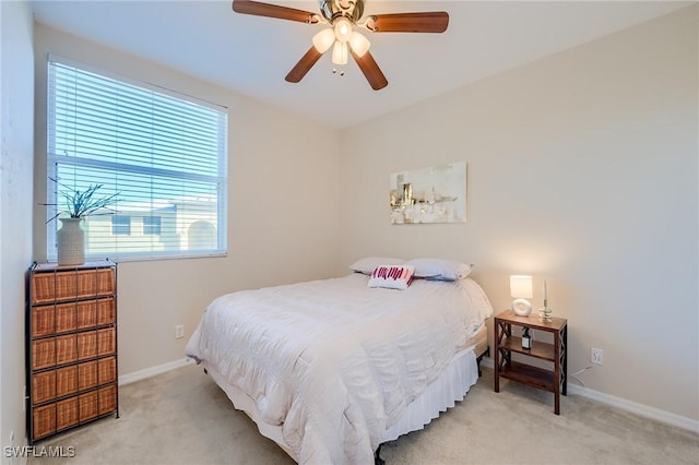 4241 Bellasol Cir Unit 1922, Fort Myers, FL 33916 - bedroom featuring light carpet, baseboards, and ceiling fan