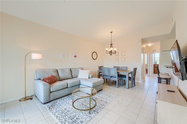 4241 Bellasol Cir Unit 1922, Fort Myers, FL 33916 - living room with light tile patterned floors, a chandelier, baseboards, and vaulted ceiling