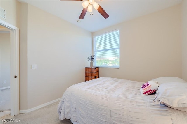 bedroom with light carpet, vaulted ceiling, and ceiling fan