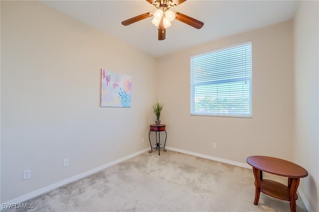 carpeted empty room with ceiling fan