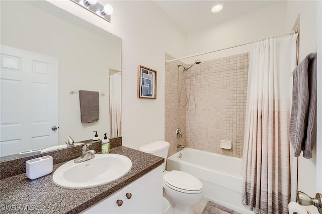 full bathroom featuring shower / bath combination with curtain, vanity, and toilet