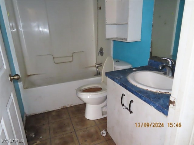 full bathroom with tile patterned flooring, vanity,  shower combination, and toilet