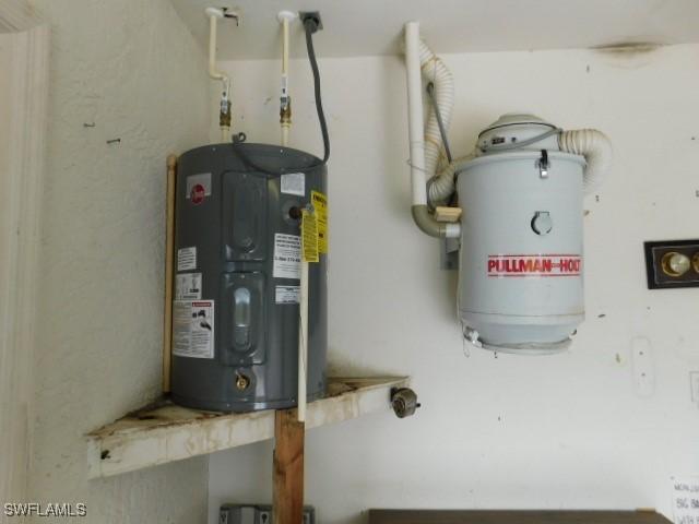 utility room featuring electric water heater