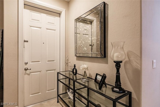 doorway featuring light tile patterned floors