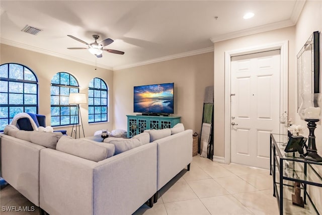 living room featuring ceiling fan, light tile patterned floors, and crown molding