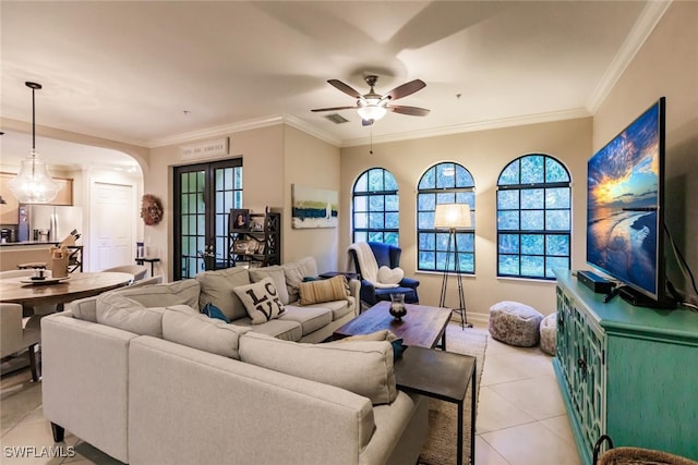 tiled living room featuring french doors, ceiling fan, and ornamental molding