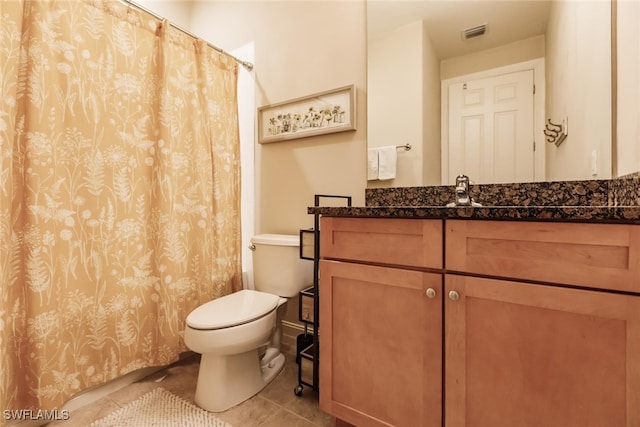 bathroom with tile patterned flooring, vanity, toilet, and a shower with curtain