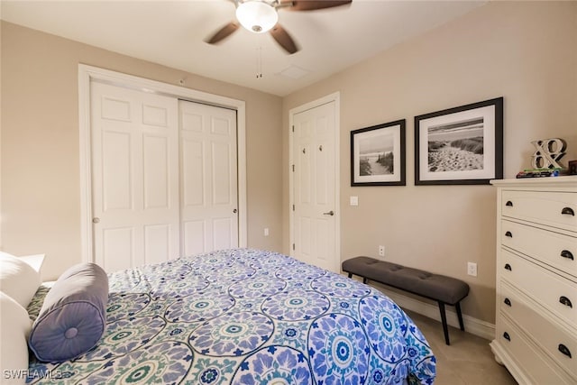 bedroom featuring ceiling fan and a closet